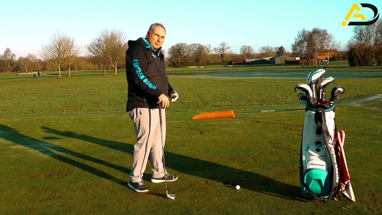 Alistair Davies teaches a golf drill for a lower handle at impact