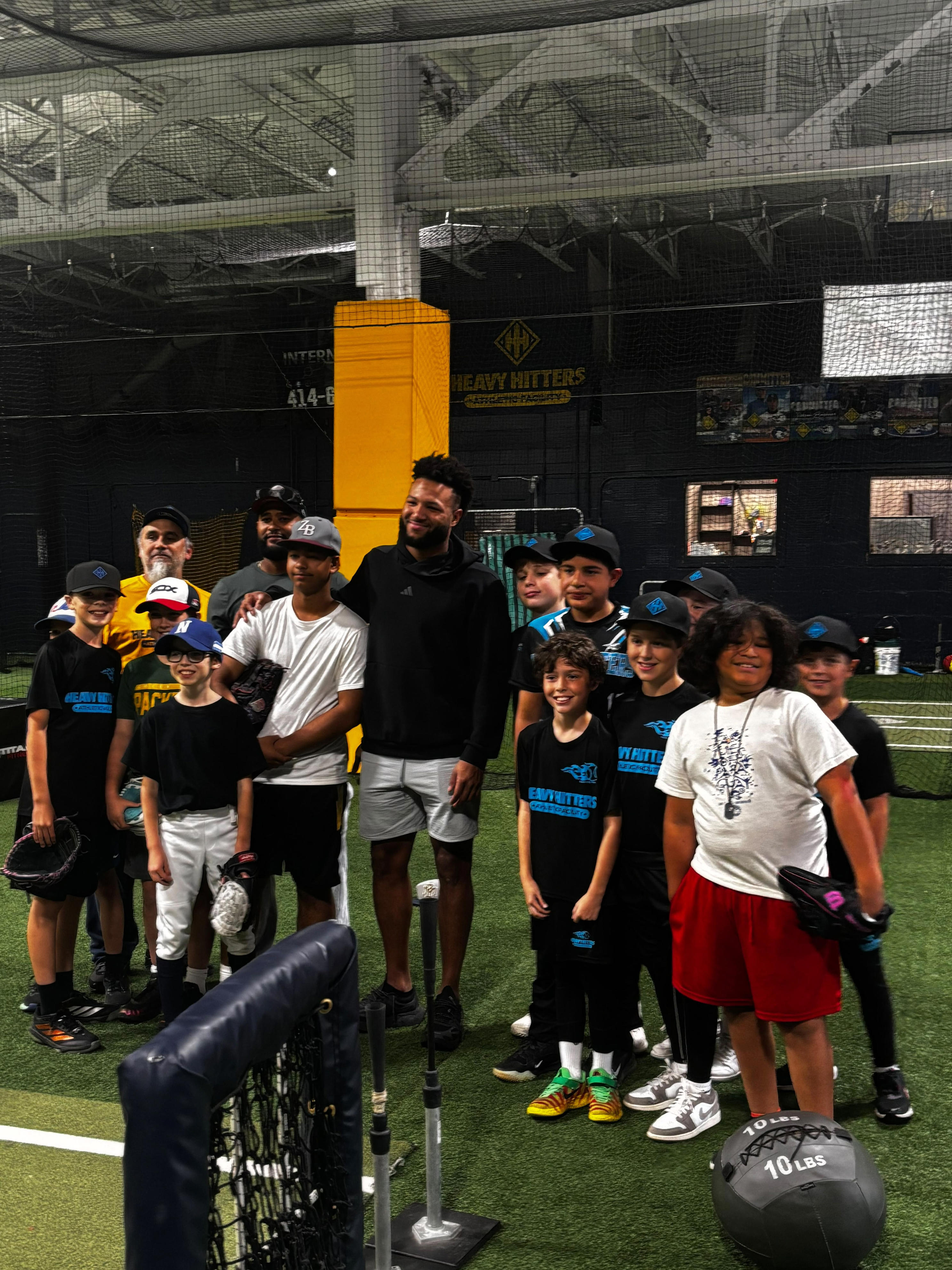 Youth baseball players cheer on Milwaukee Brewers in World Series Game 1