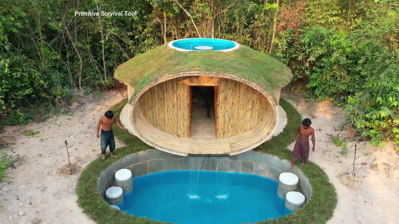 Jungle builders build a grass-roofed oval house with a pool