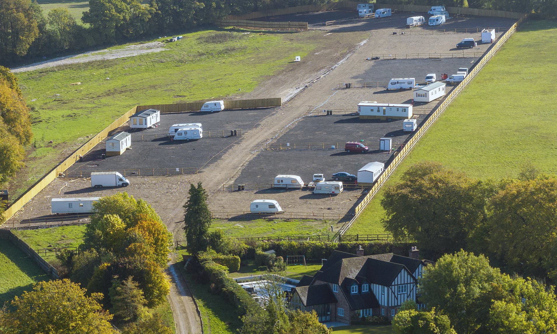 Million-pound homeowners 'terrorised' by balaclava-clad travellers who set up camp right next door