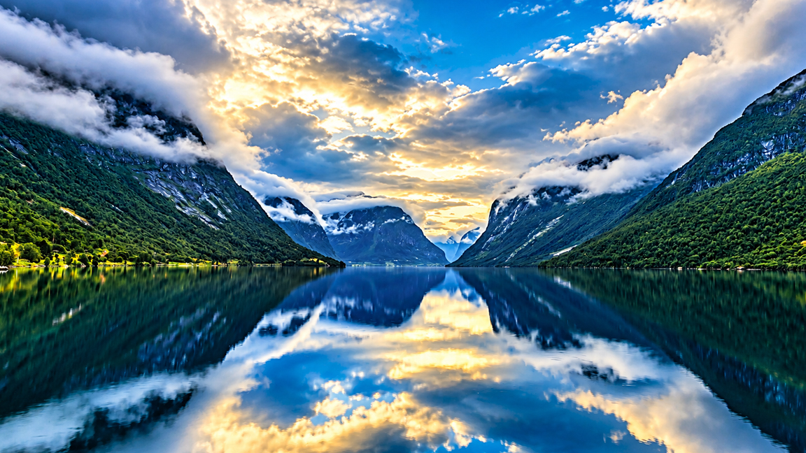 Norway's breathtaking fjord with perfect mountain reflections at sunset