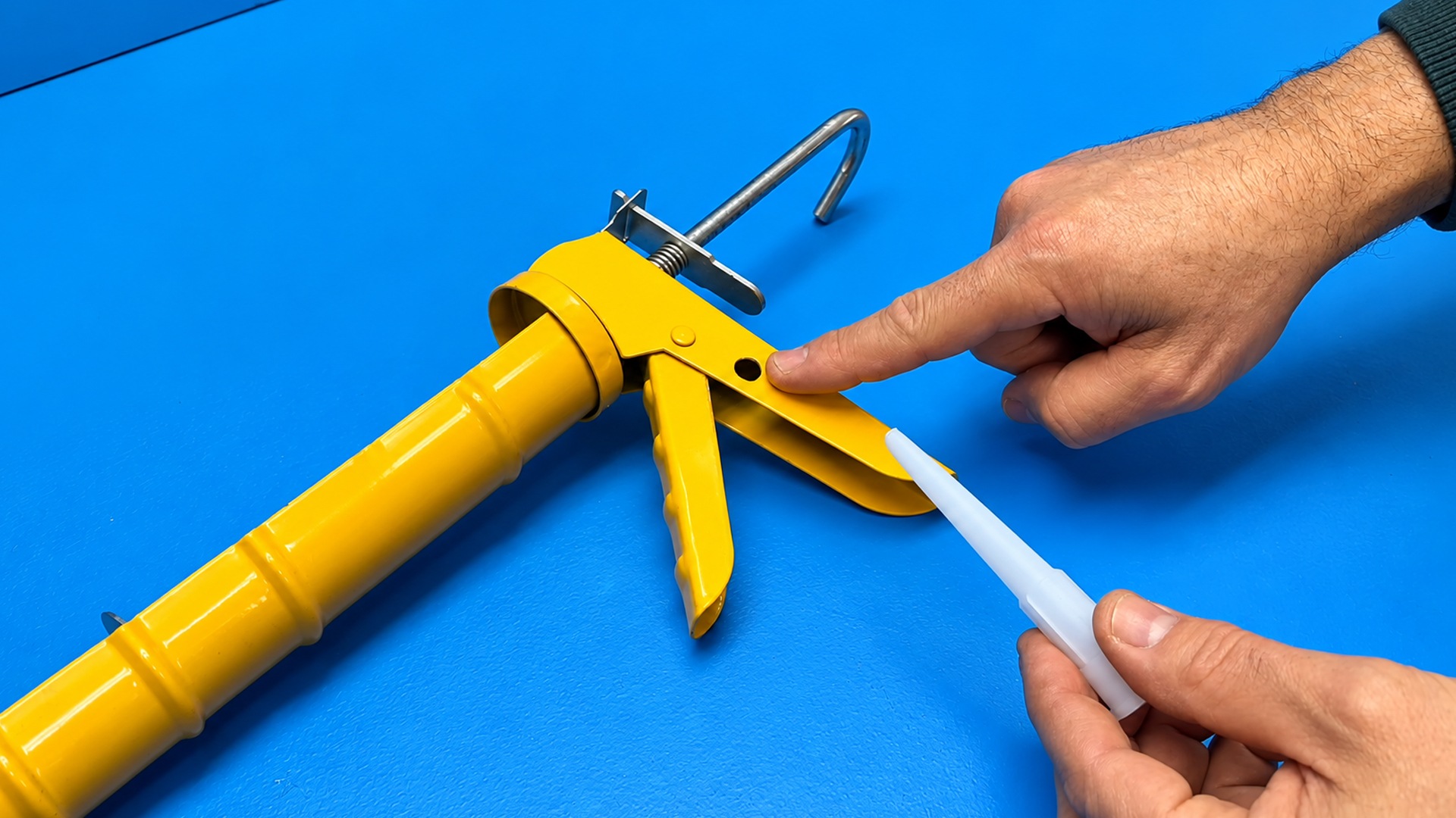 Watch how painters cut caulking tips to seal baseboards without tape