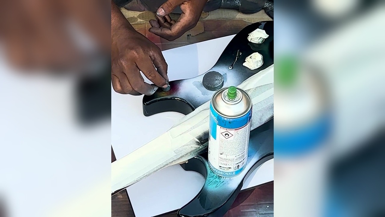 Spray painting a rock'n'roll guitar in Rome