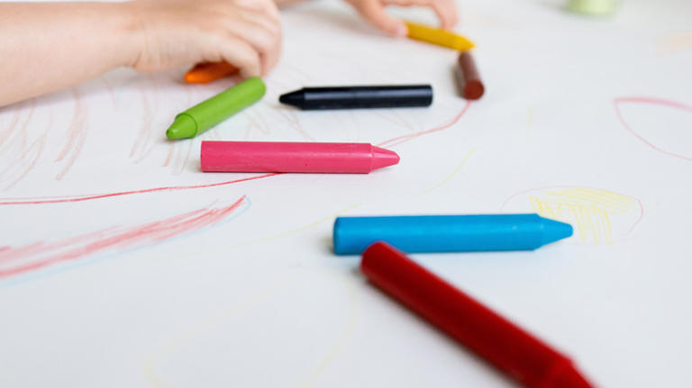 Use old crayons to transform plain candlesticks into unique decor