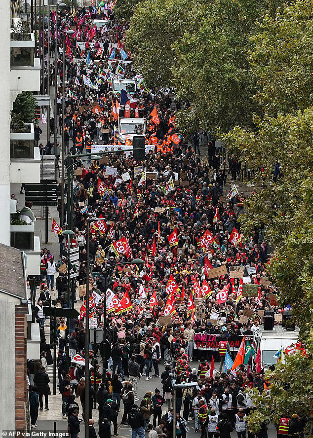 French police seize weapons and gas masks and make arrests as day of ...