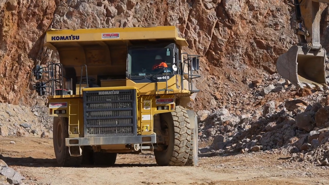 Massive mining dump truck ready for rock loading at a quarry