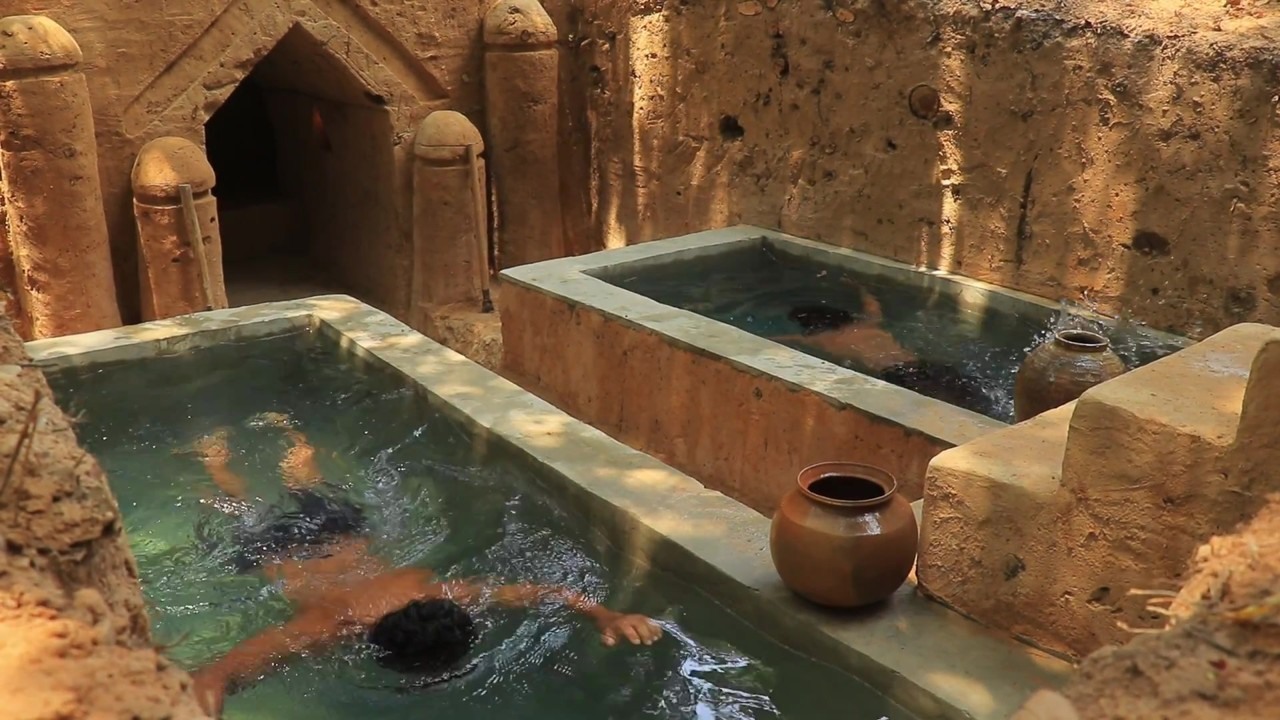 Underground wood-root house with twin pools