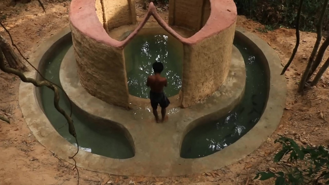 Curved fish ponds around a round earthen pool