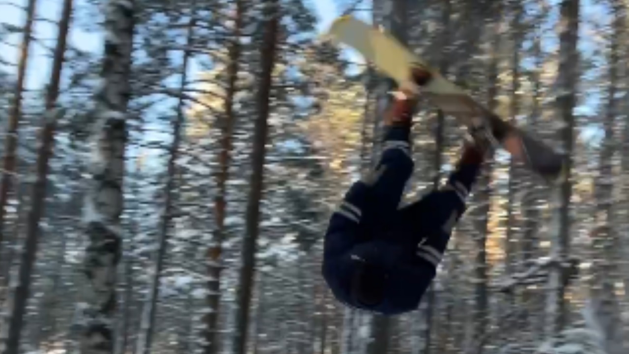 Snowboarder in police uniform attempts flip and crashes