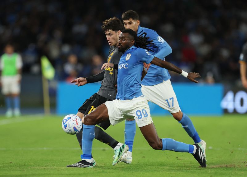 Soccer-Lazio go top with win over Parma as Roma rally to draw 3-3 at Napoli