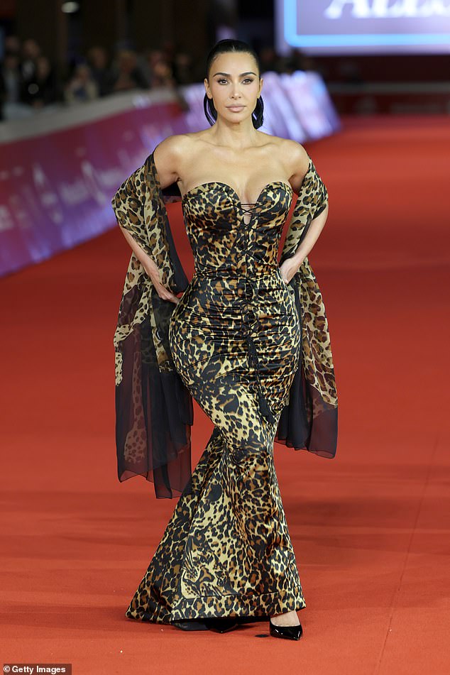 Kim Kardashian turns heads in a strapless leopard print dress at the ...