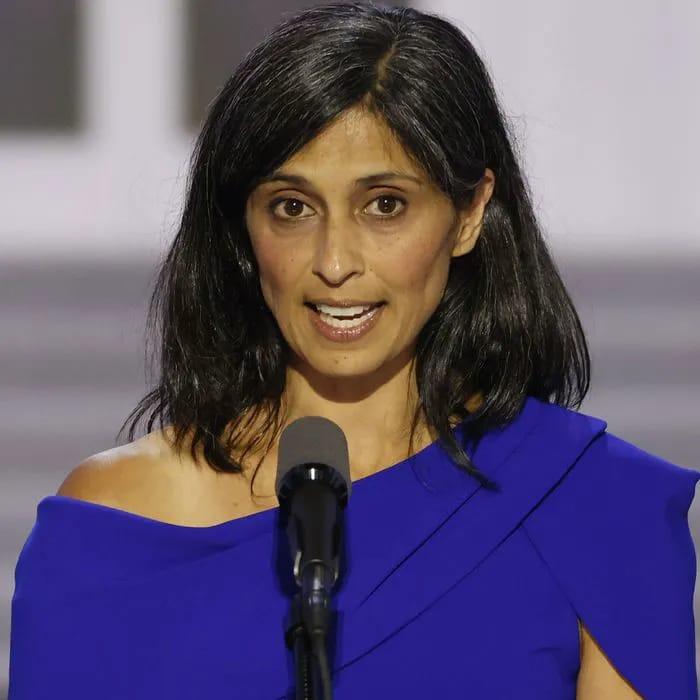 Usha Vance wears plaid blazer while carrying her newborn baby at women's health executive order signing