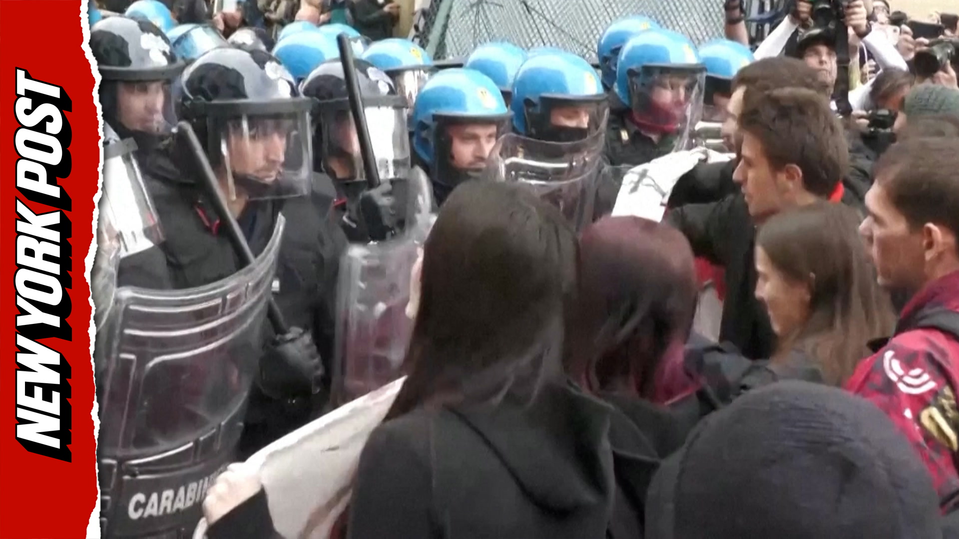 Riot police baton-charge protesters marching against defense summit in ...