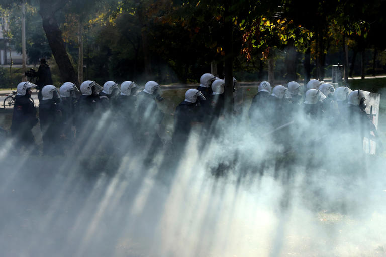 Soldiers guard center of Milan as thousands of protesters march in ...