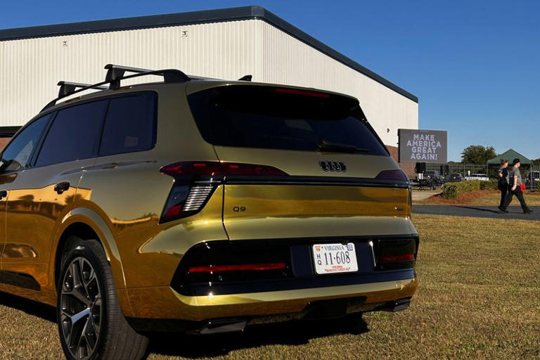 A gold Audi Q9 SUV is displayed outside the venue of US President Donald Trump's political rally before his arrival in Perry, Georgia, US, October 24, 2026. REUTERS/Bo Erickson
