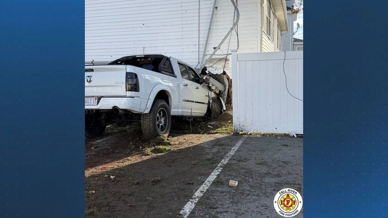 Person rescued from underneath truck after crash into Fall River building