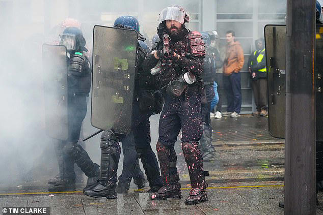 French riot police hit far-left mobs with water cannon as protests ...
