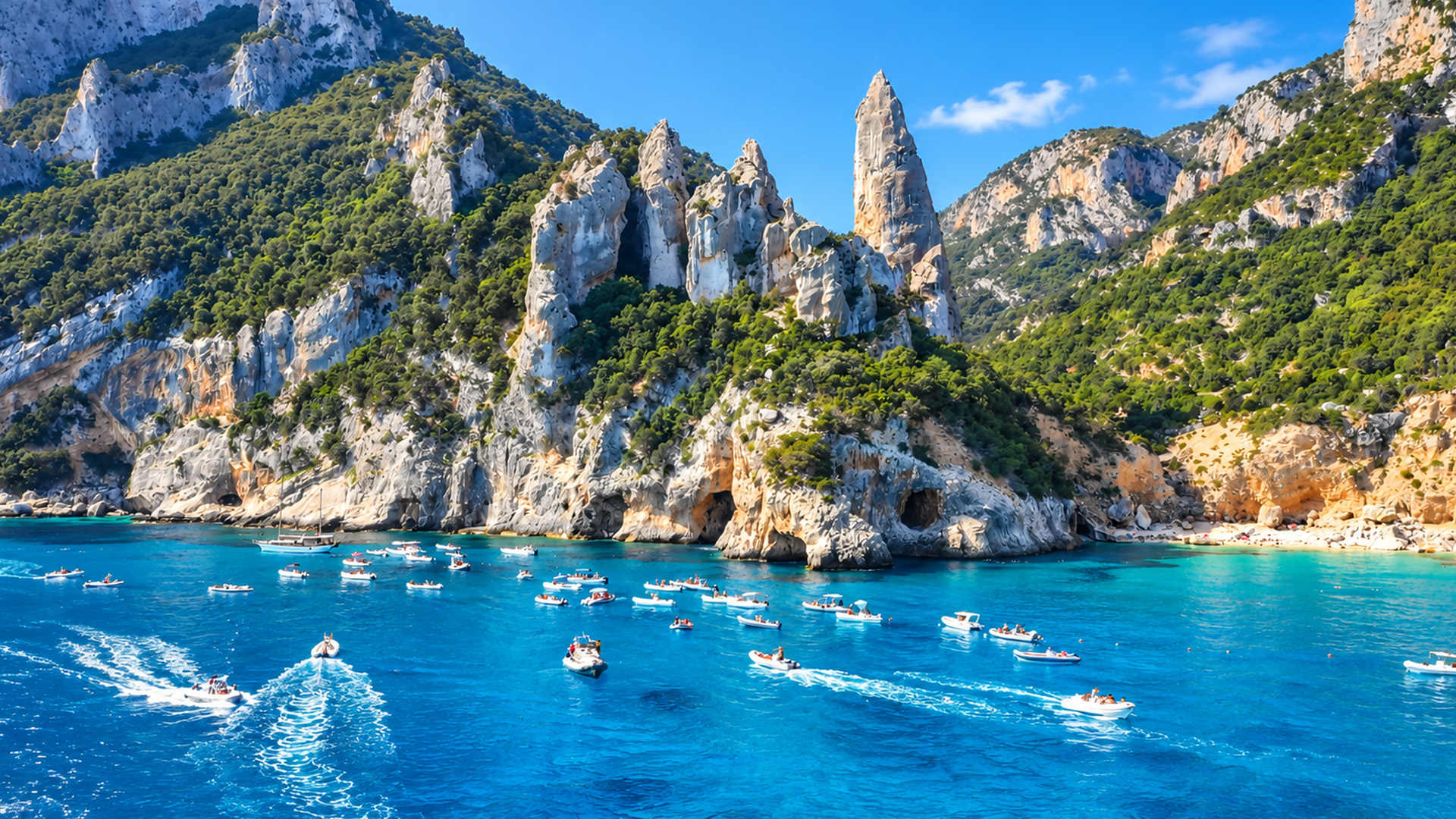 The rocky coast of Sardinia filled with small boats