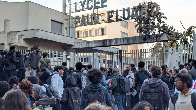 Students gather in front of barricaded gates at the Lycee Paul-Eluard high school in the northern Paris suburb of Saint-Denis, France, on September 29. - Luc Auffret/Anadolu/Getty Images