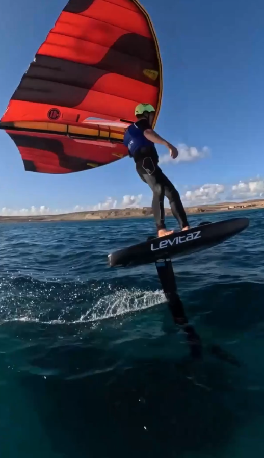 High speed wing foiling across open water