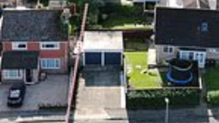 Priest caught on CCTV sprinkling holy water on disputed fence as fight ...