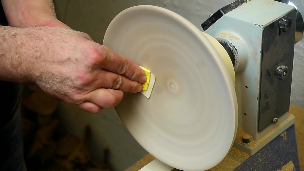 Woodturner makes a fruit bowl with small round legs from plywood scraps