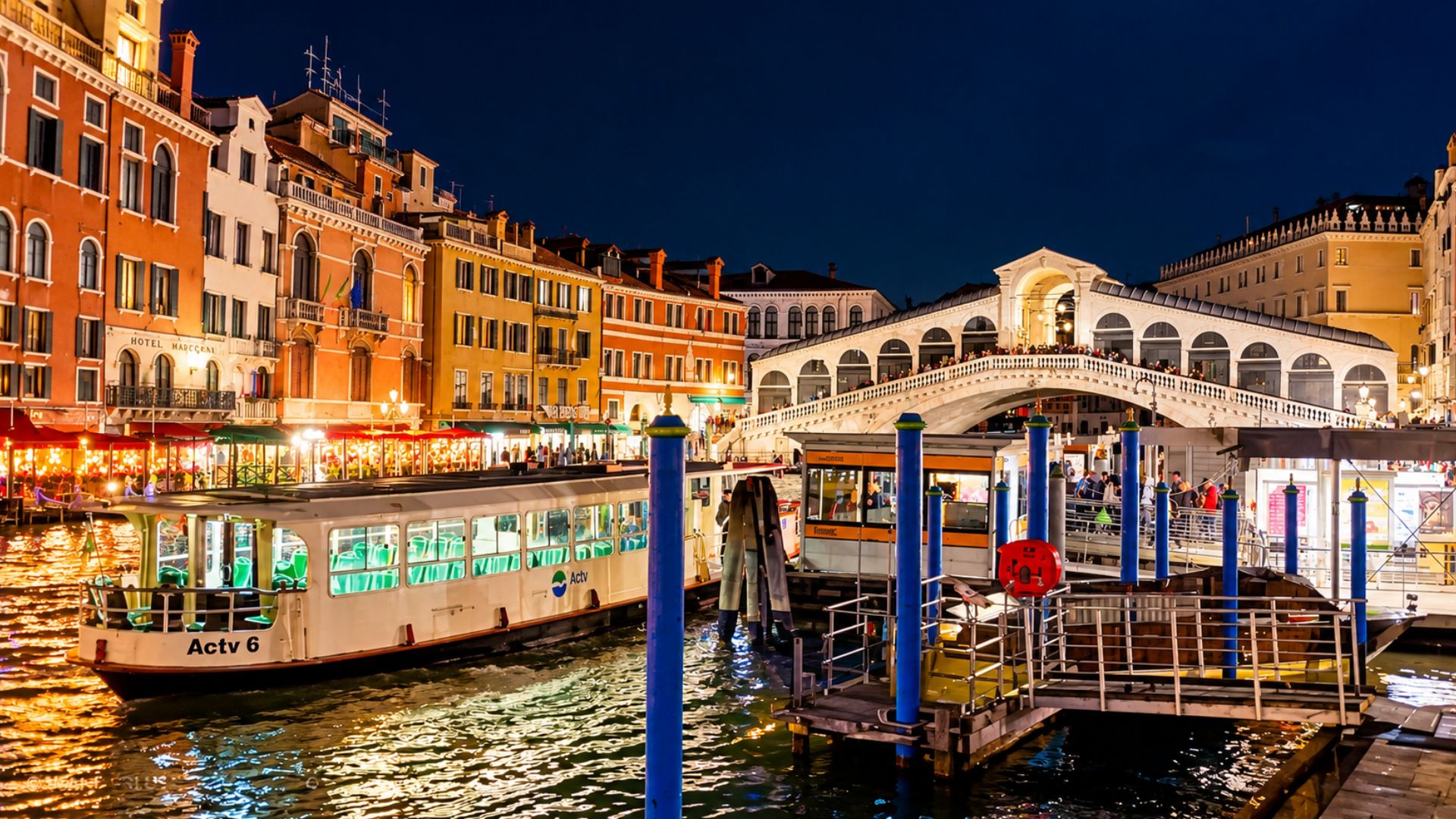 What does Venice's famous Rialto Bridge look like after dark?