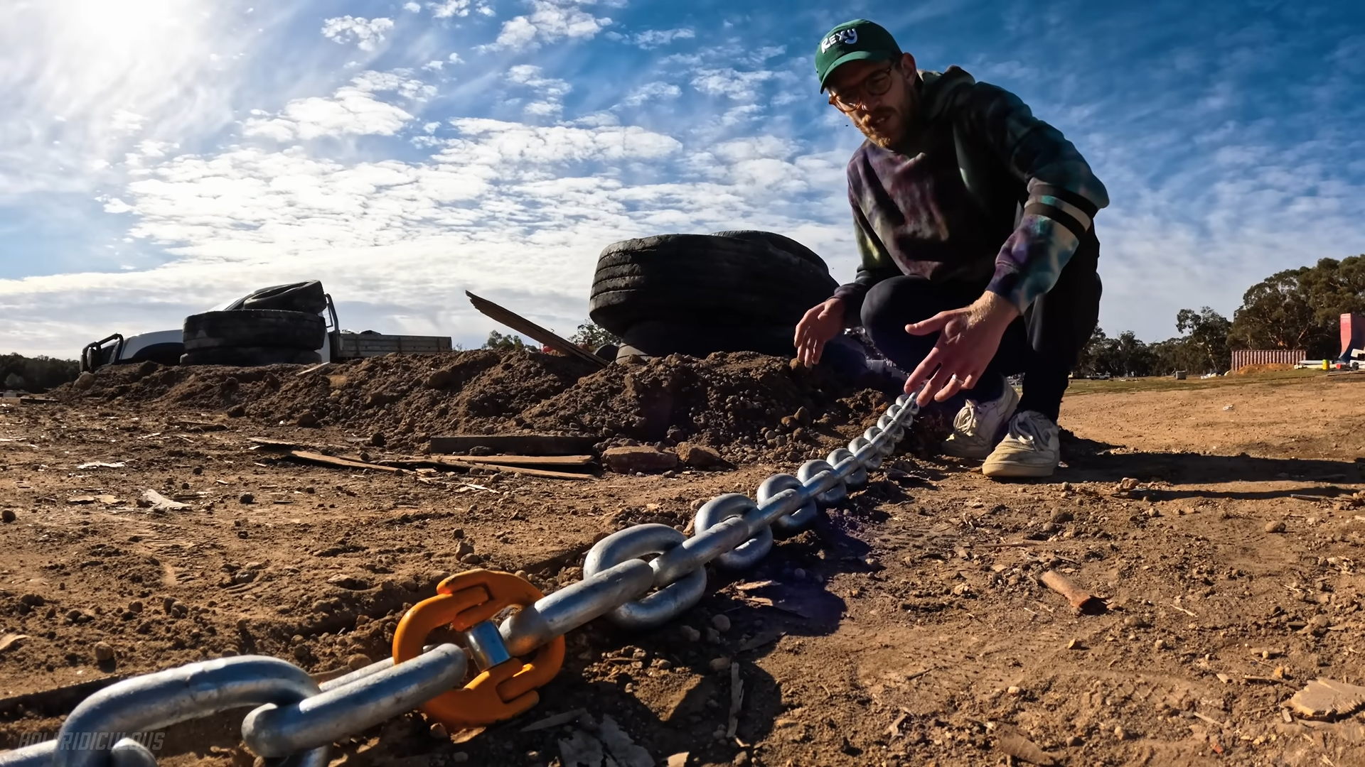 Building a giant chain whip and testing its power against a house