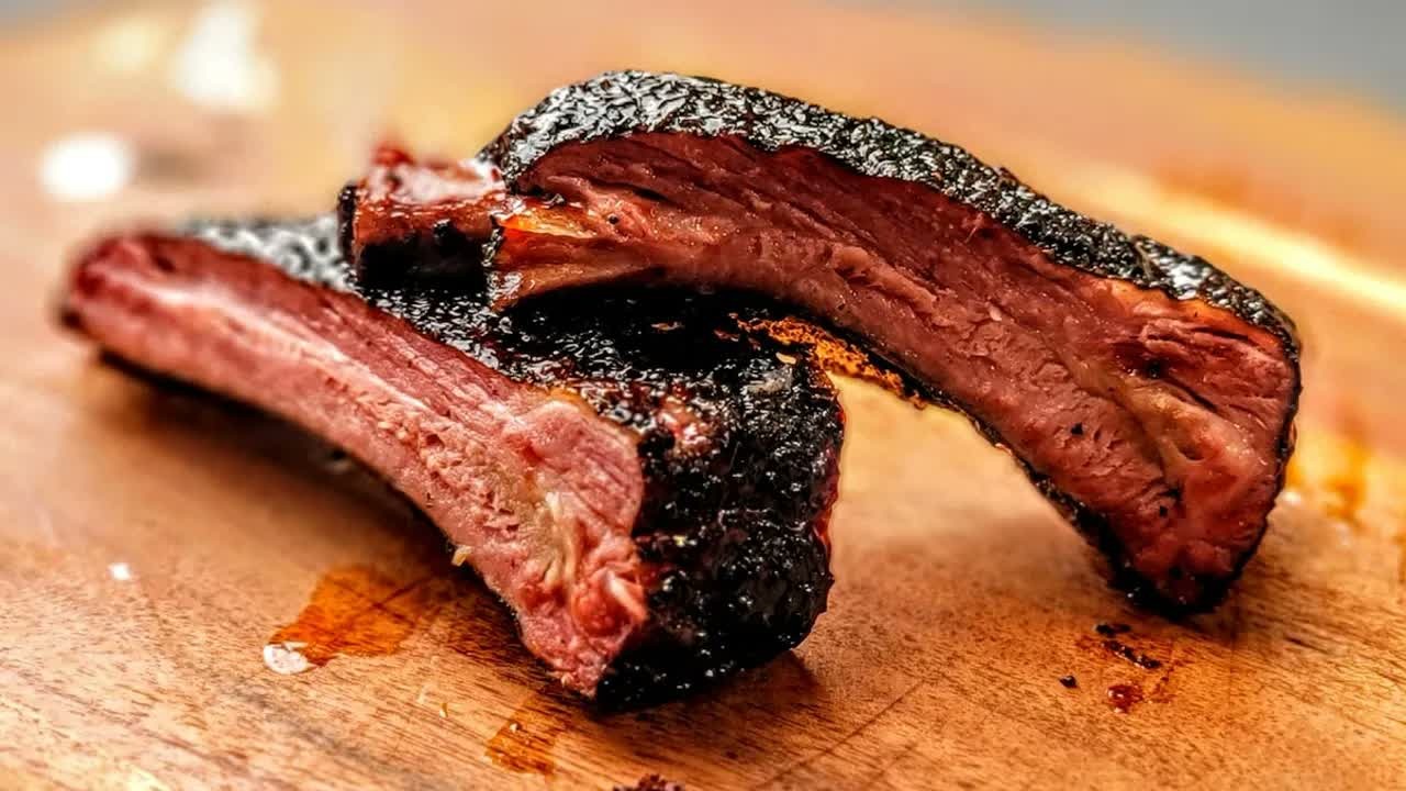 A BBQ cook tests wrapped and unwrapped smoked ribs