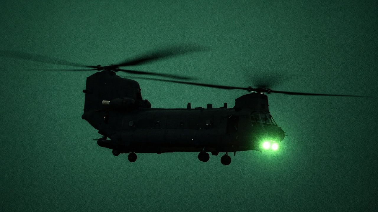 Chinook opens fire with its M134 minigun - tracer rounds light up the range