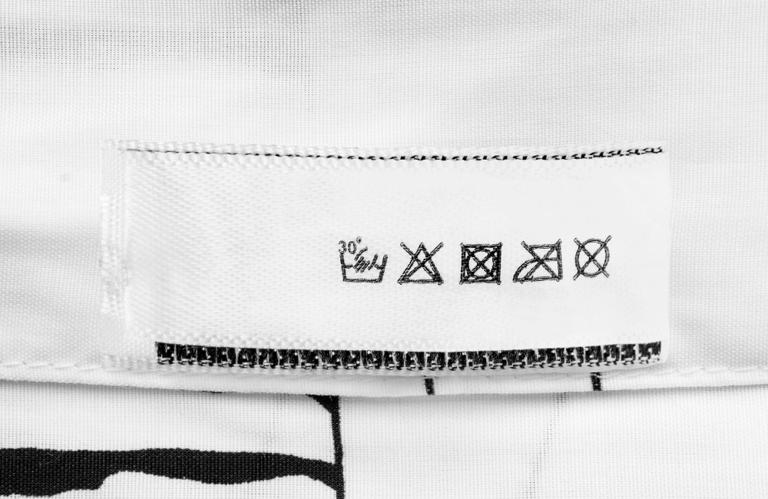 The symbols on a clothing label are a complete language and almost ...
