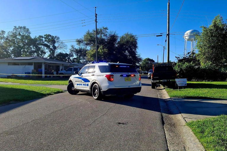 Police car parked outside the Bradenton, Fla., home where Phillip McClure and Brenda McClure were found dead on Oct. 22, 2026 Credit: Bradenton Police Department