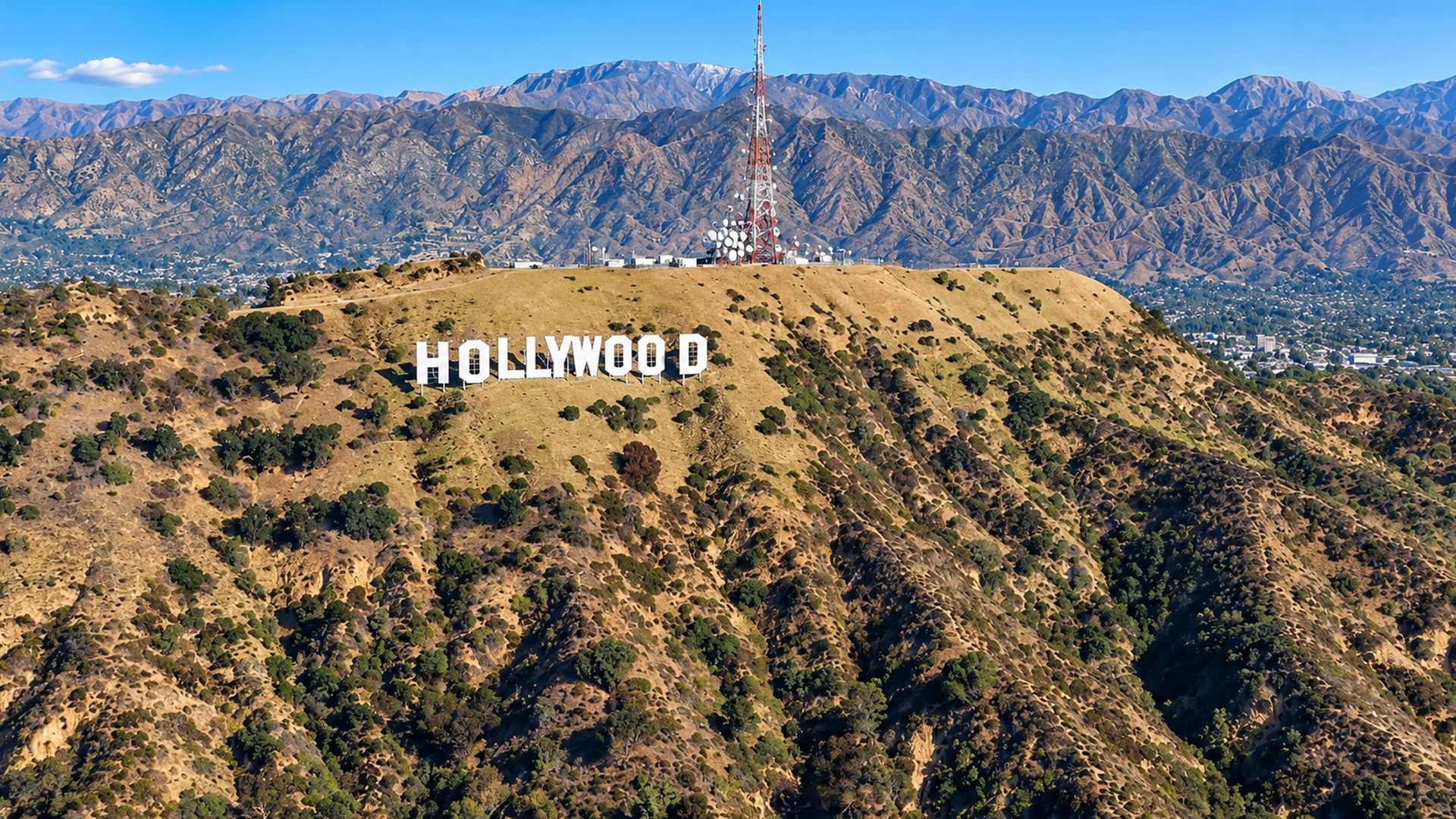 Los Angeles spreads beyond the ridge behind the Hollywood sign