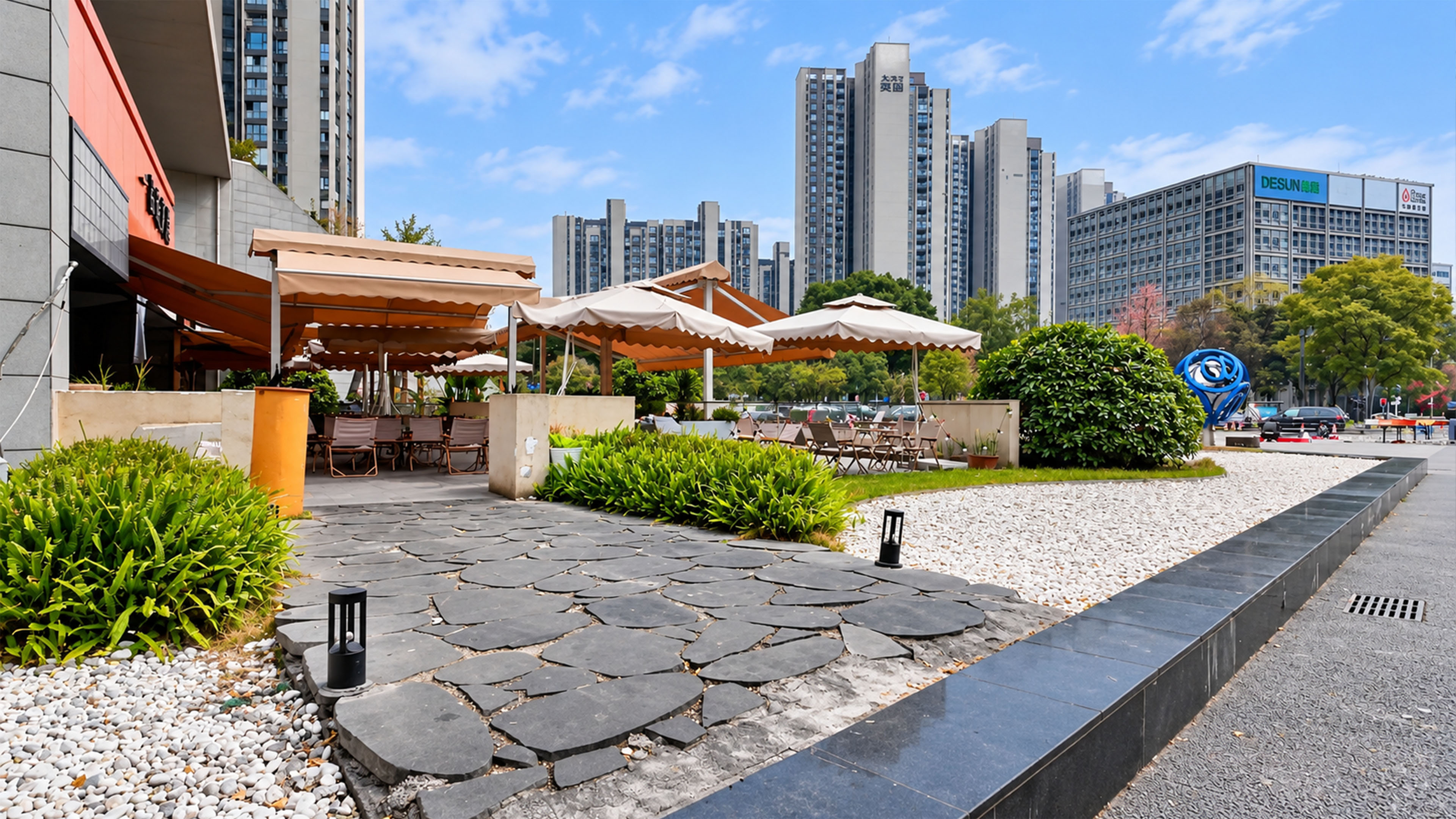 This outdoor cafe in China sits beneath giant apartment towers