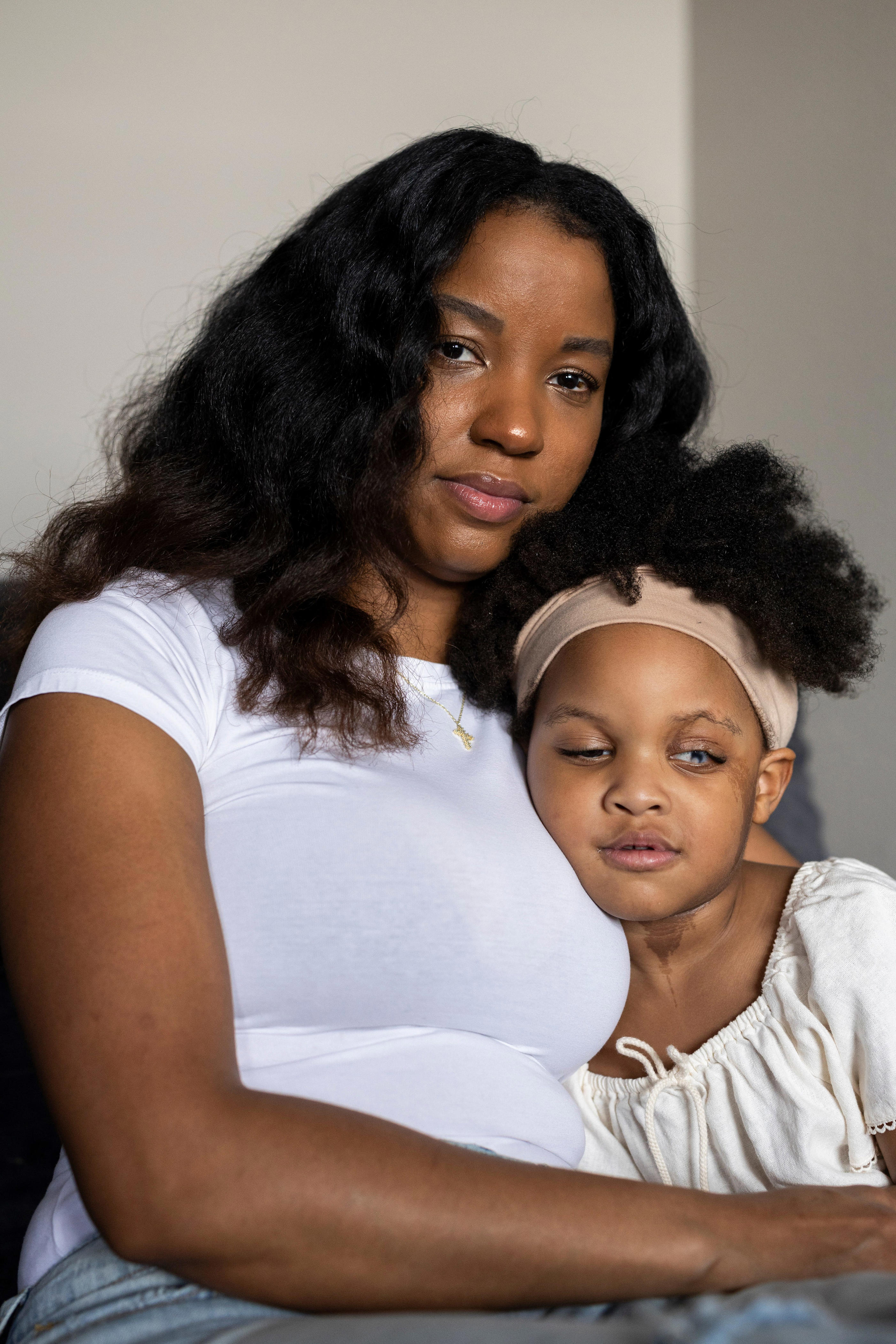 Briana Grace, 31, poses with her daughter Soraya, 3, at her home in The Woodlands, Texas, on Sept. 29, 2026. The 31-year-old payroll specialist was laid off after four years of steady employment earlier this year.