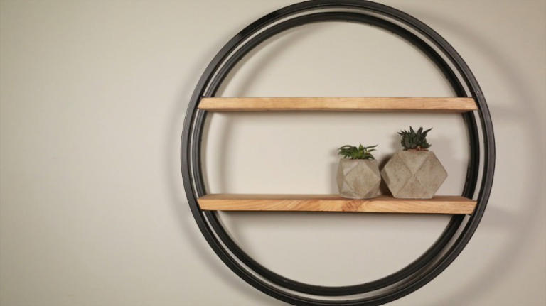 Stop tossing old bike wheels: make rustic wall storage shelves instead
