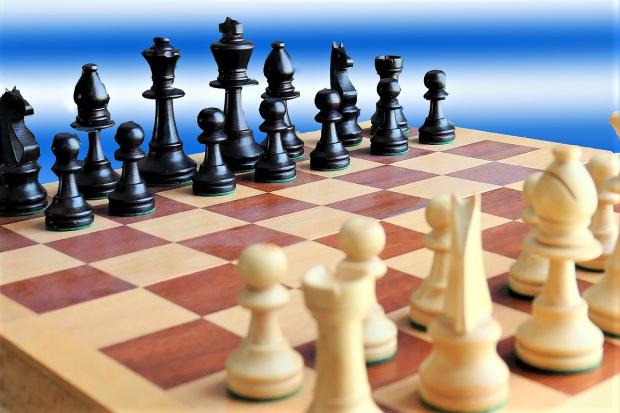 Island man plays 12 simultaneous chess games - County Press archive