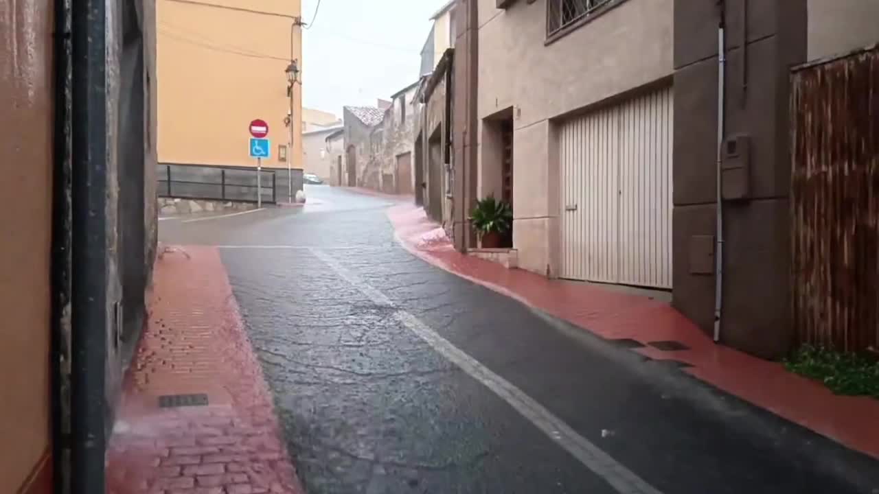 Heavy rainfall floods streets during an intense evening downpour in ...