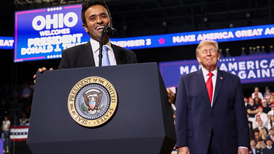 Gubernatorial candidate Vivek Ramaswamy, alongside US President Donald Trump, speaks in Youngstown, Ohio, on October 12. - Kevin Lamarque/Reuters
