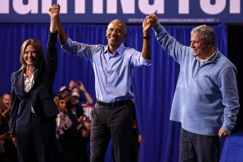 Former US President Barack Obama joins hands with former US Senator Sherrod Brown (D-OH) and Democratic gubernatorial candidate Amy Acton after a rally ahead of the midterm elections in Cleveland, Ohio, US, October 24, 2026. REUTERS/Shannon Stapleton