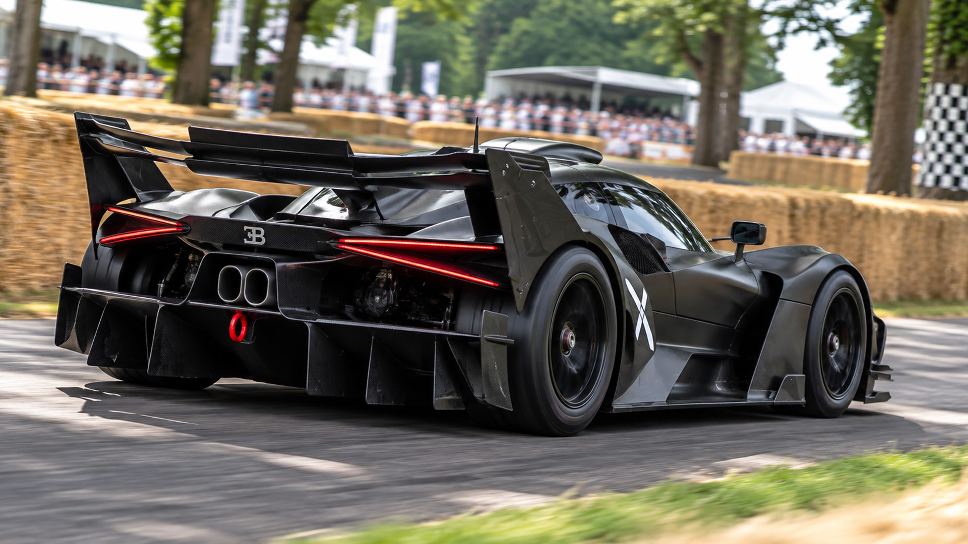 Bugatti Bolide accelerating at a motorsport event