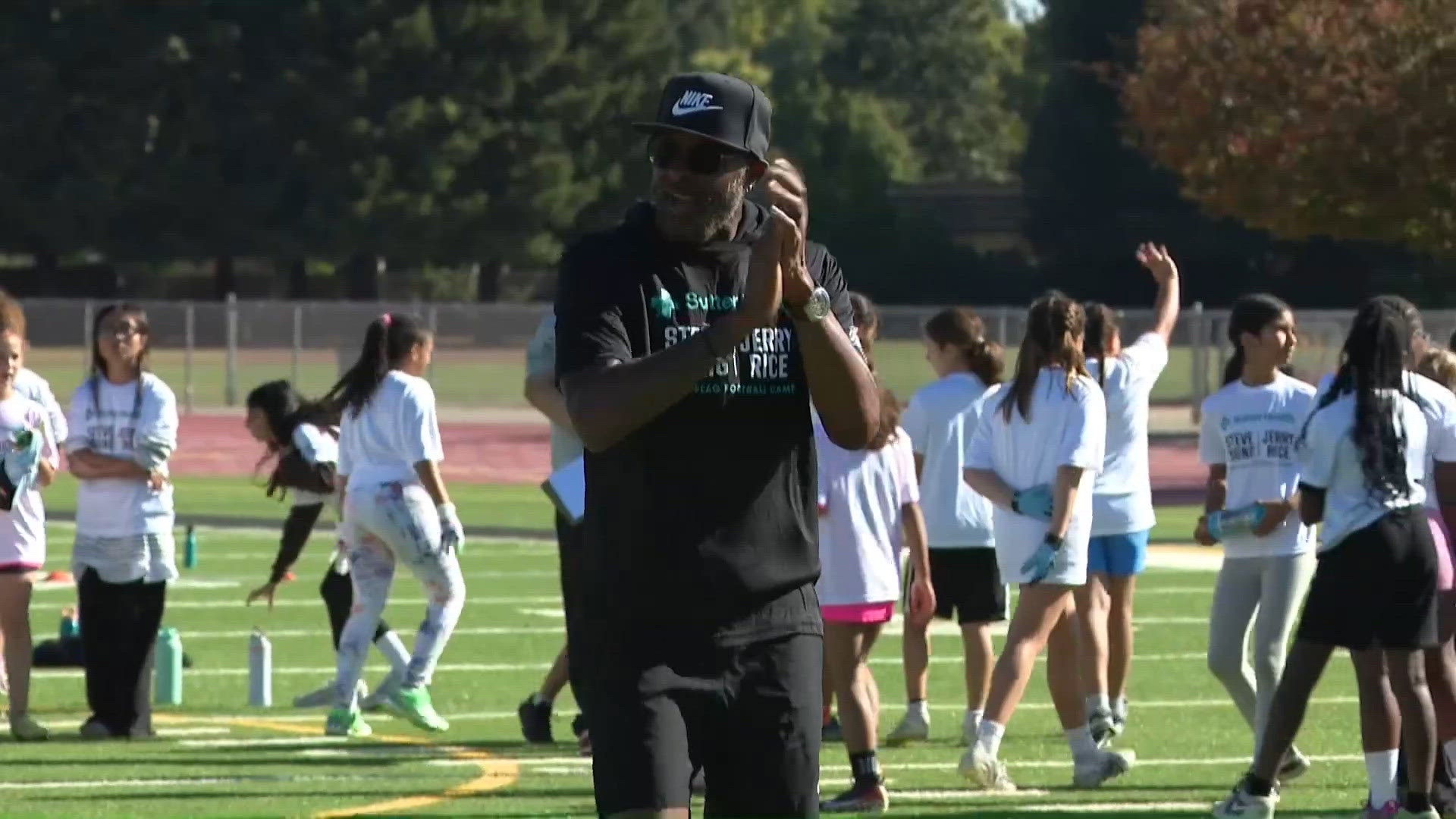 Jerry Rice and Steve Young teach girls flag football at Jesuit