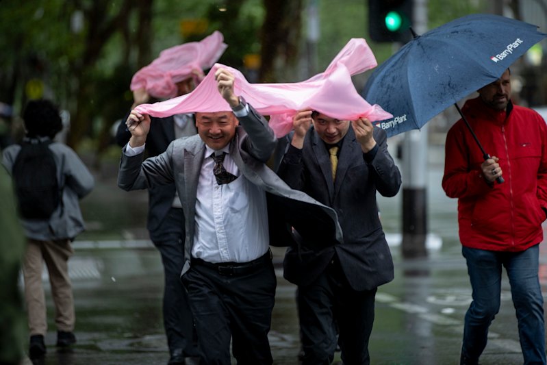 Soggy streets, icy winds: Melbourne shivers through spring cold snap
