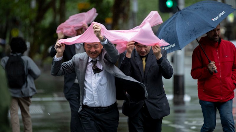 Soggy streets, icy winds: Melbourne shivers through spring cold snap
