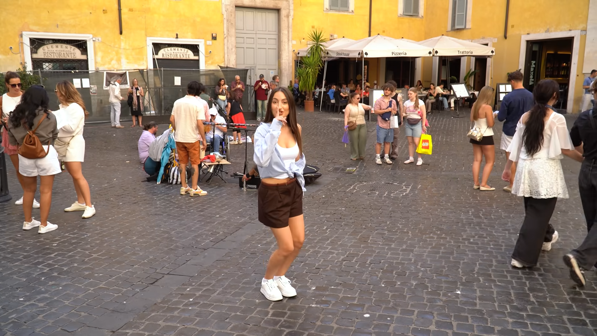 Spray painting a woman’s suitcase in Rome