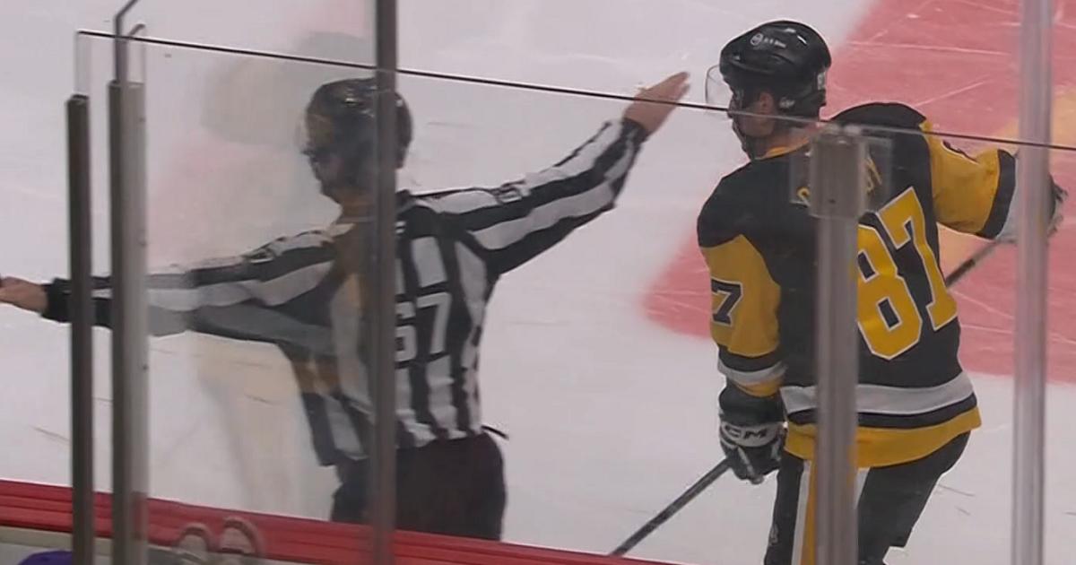 Sidney Crosby goes down after getting a karate chop to the face from a ...