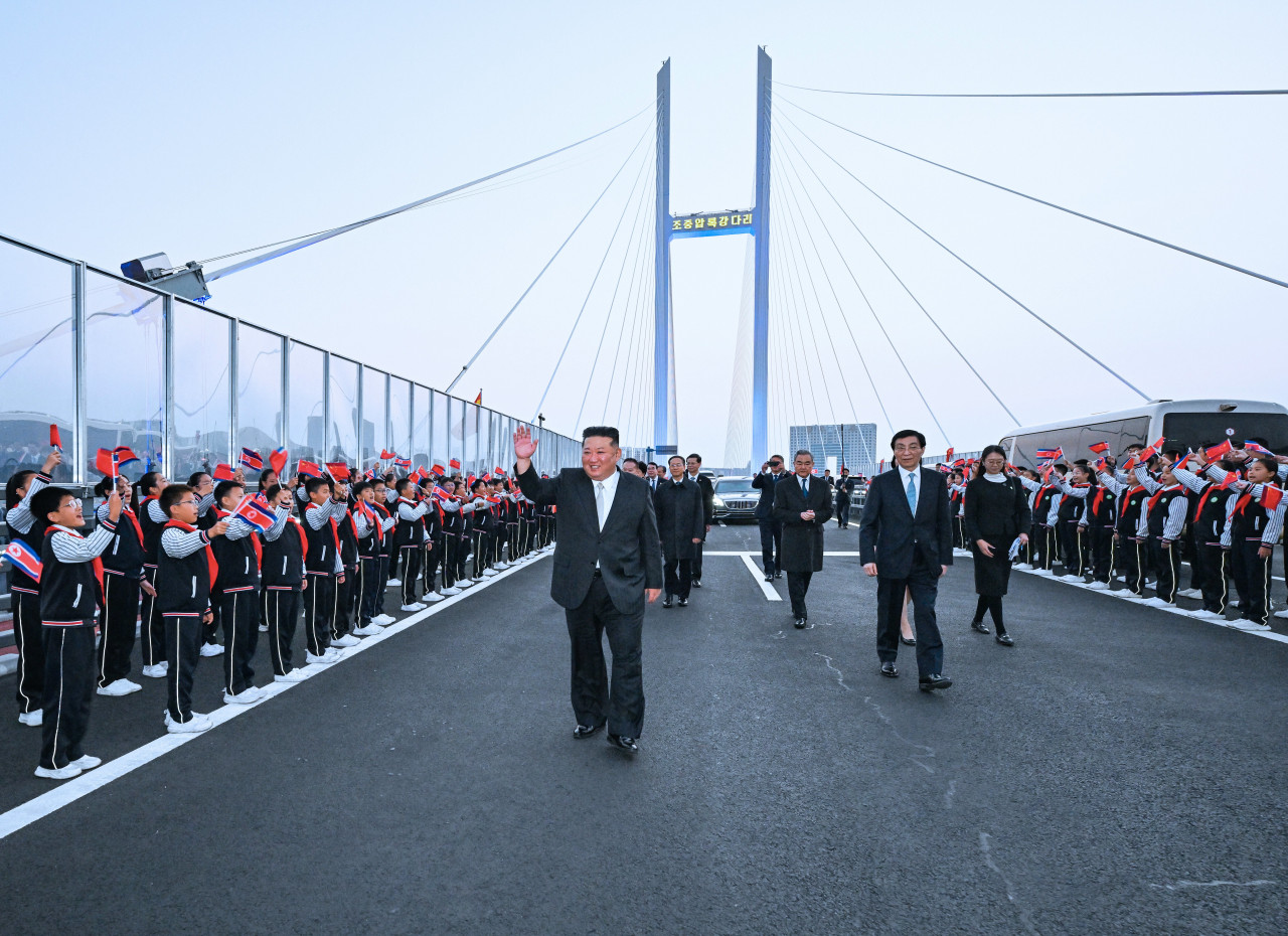 Kim Jong Un makes surprise trip to China, crosses new bridge