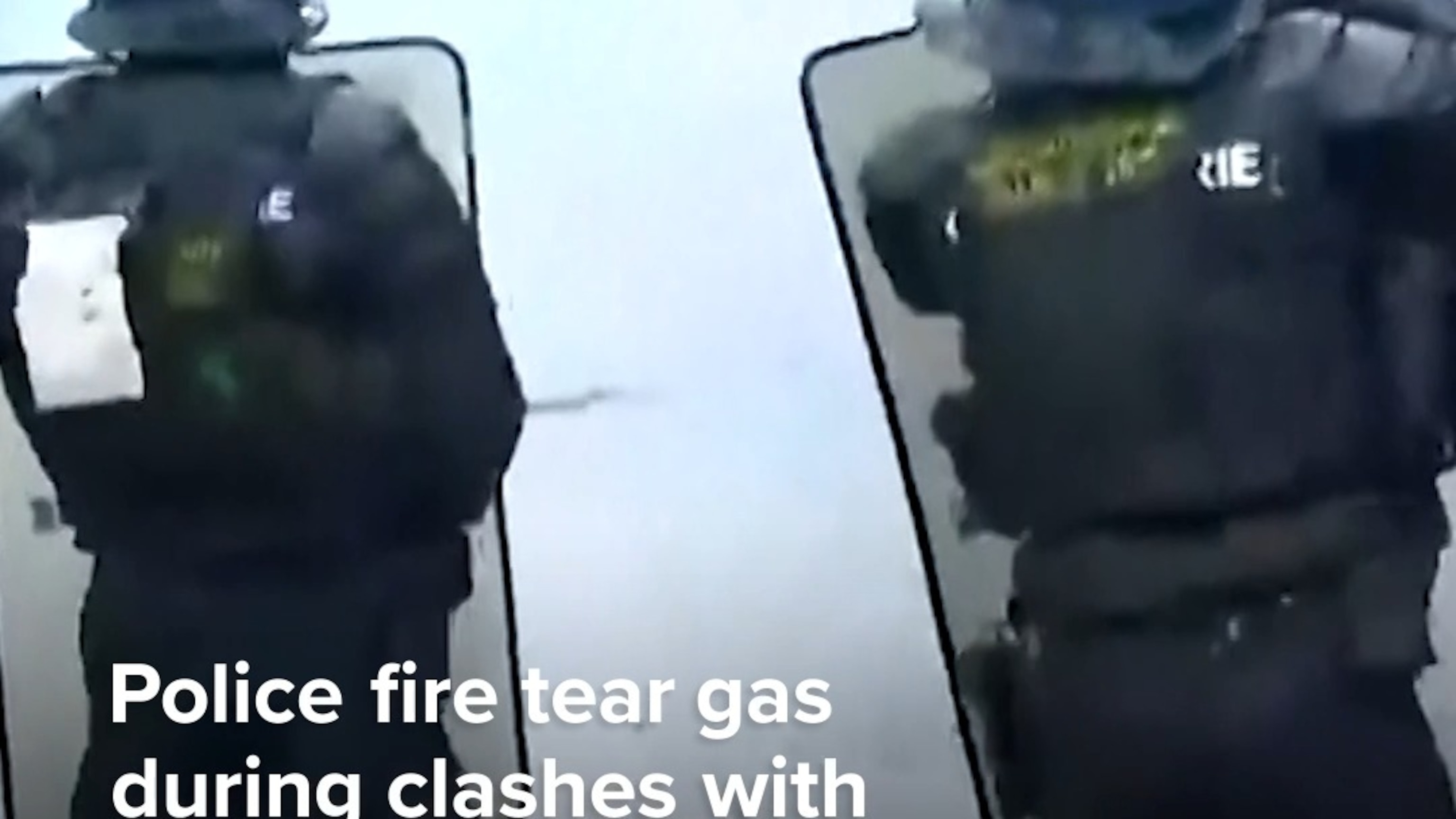 Police fire tear gas during clashes with protesters in Paris