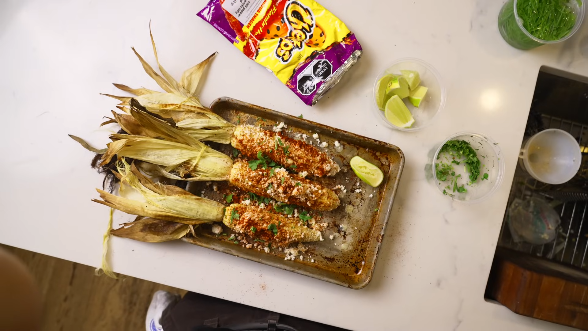 Elote roasted in the husk with corn milk glaze