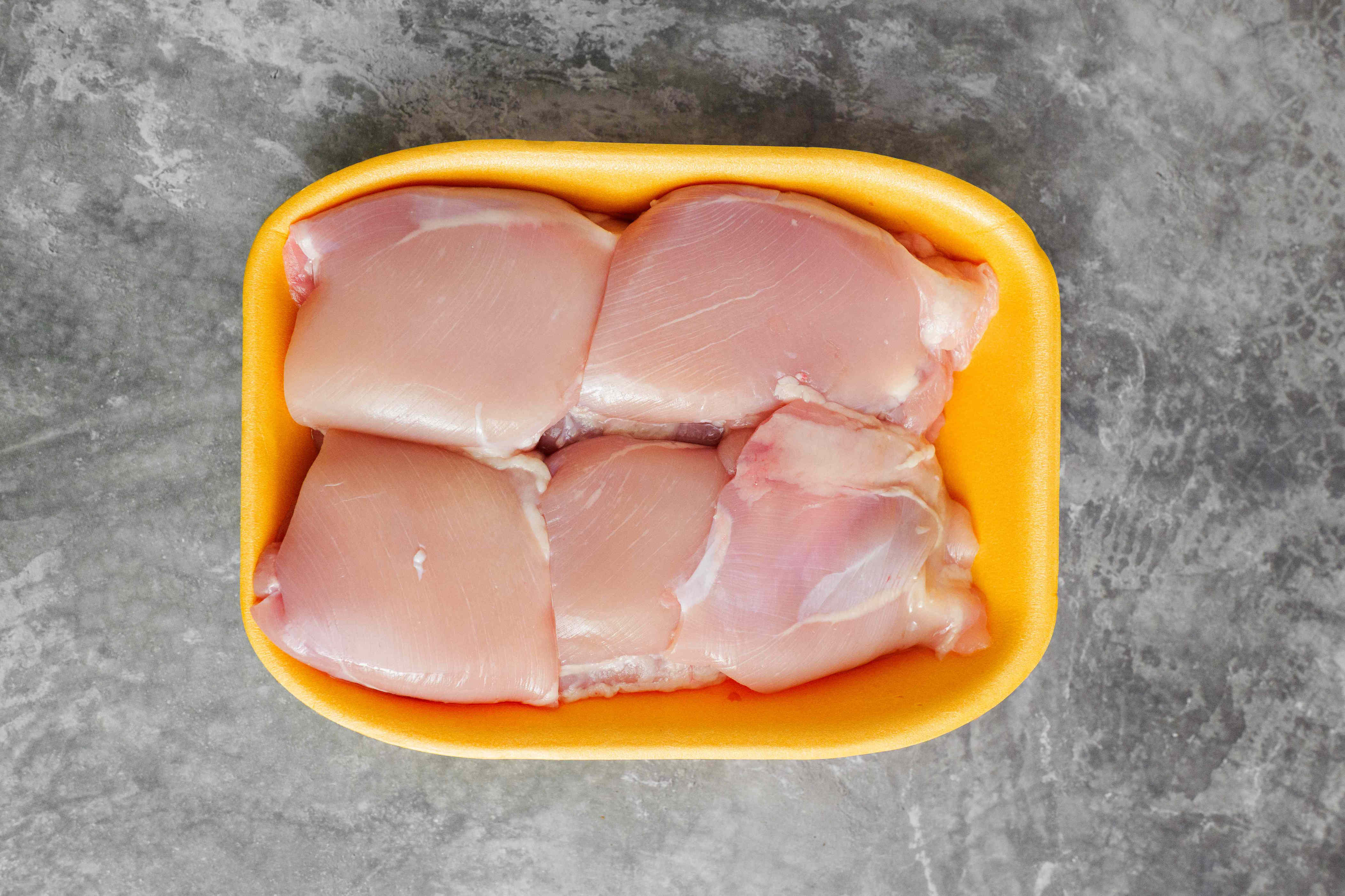 The safest way to store raw chicken, according to food safety experts